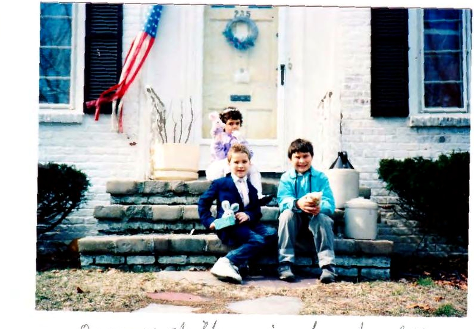 Qayum Safi's children in front of the family home in Warwick, Rhode Island