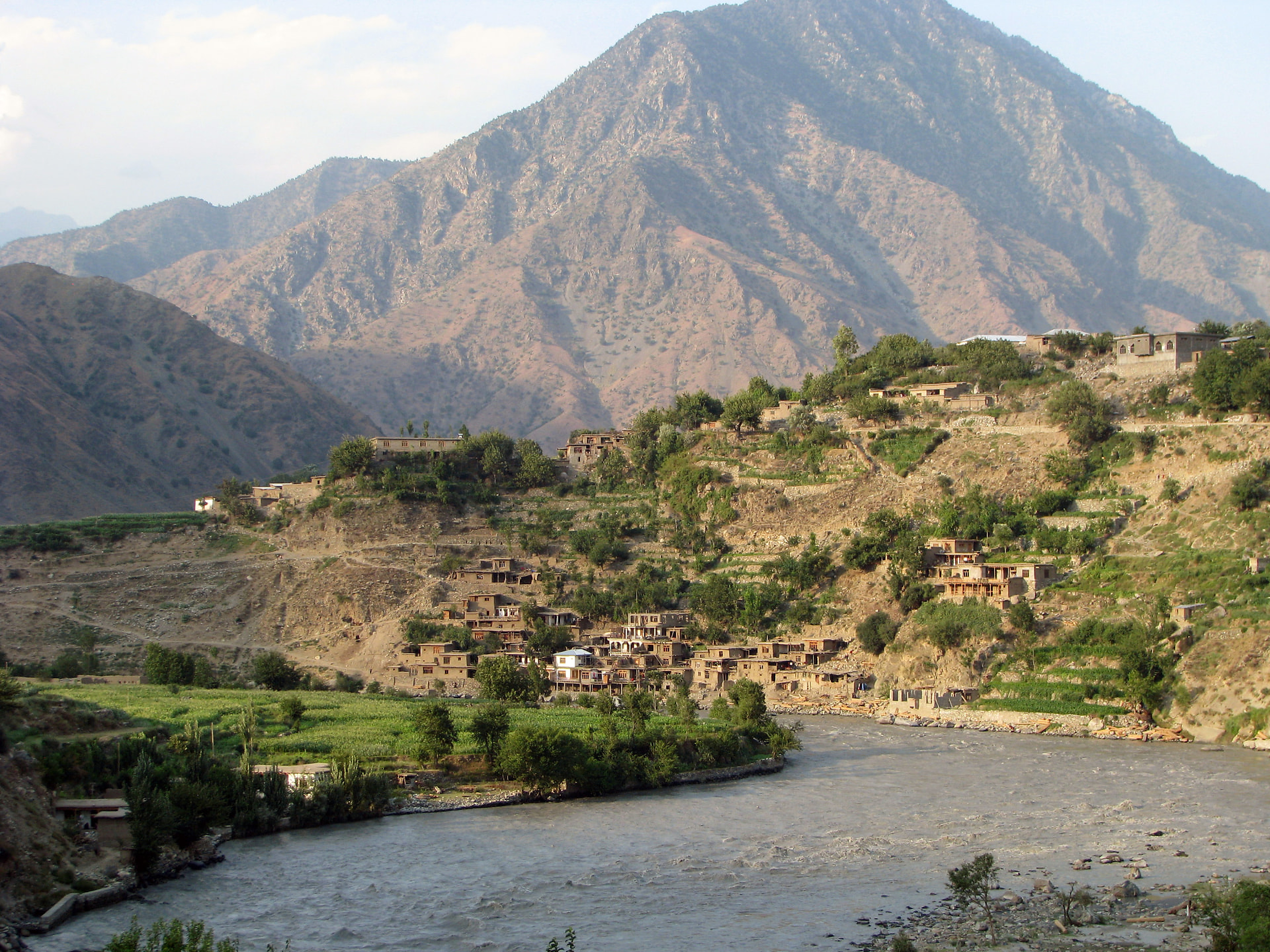 A riverside village beneath the mountains of Kunar, Afghanistan